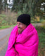 Brandon wearing the hot pink hoverquilt in oregon forest